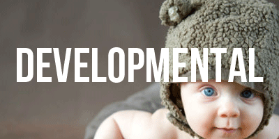 Photo of a baby wearing a bear hat to the right of the photo. The word 'Developmental' is in the middle of the photo
