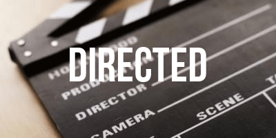 Photo of a clapperboard. The word 'Directed' is in the middle of the photo
