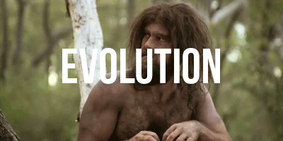 Picture of a caveman in a wooded area. The word 'Evolution' is in the middle of the photo