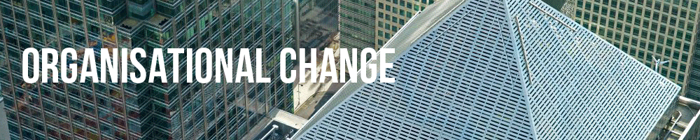 Picture of the top of a tall building. The words 'Organisational Change' are written on the left-hand side